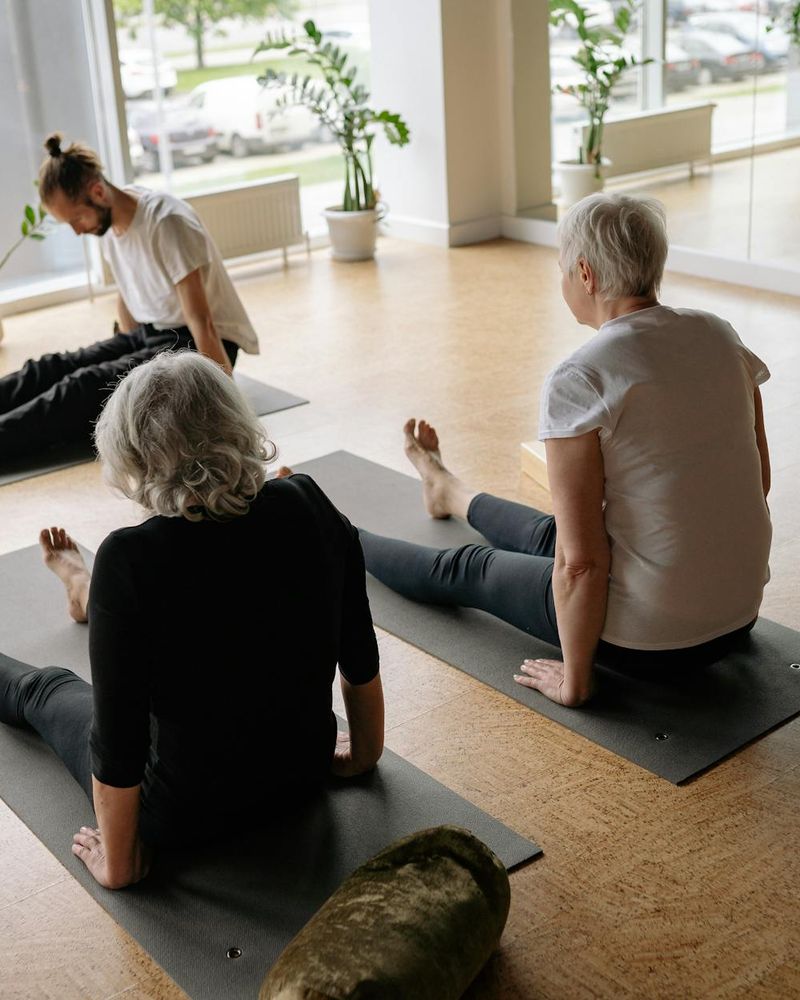 Detailed view of a yoga sequence in a dark room.